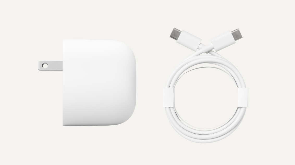 A power adapter and coiled power cable.