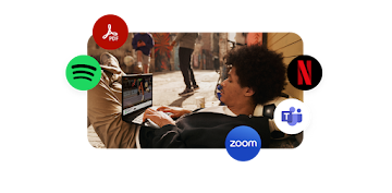 Man using a Chromebook with apps icons around him
