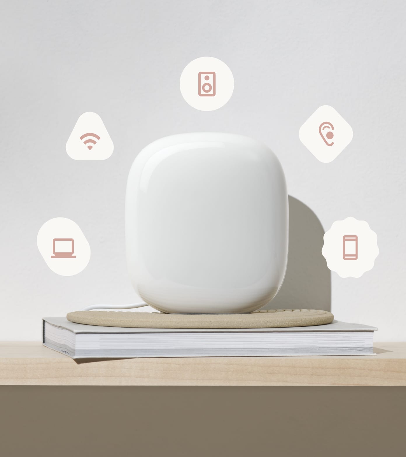 Snow-colored Nest Wifi Pro sitting on a desktop