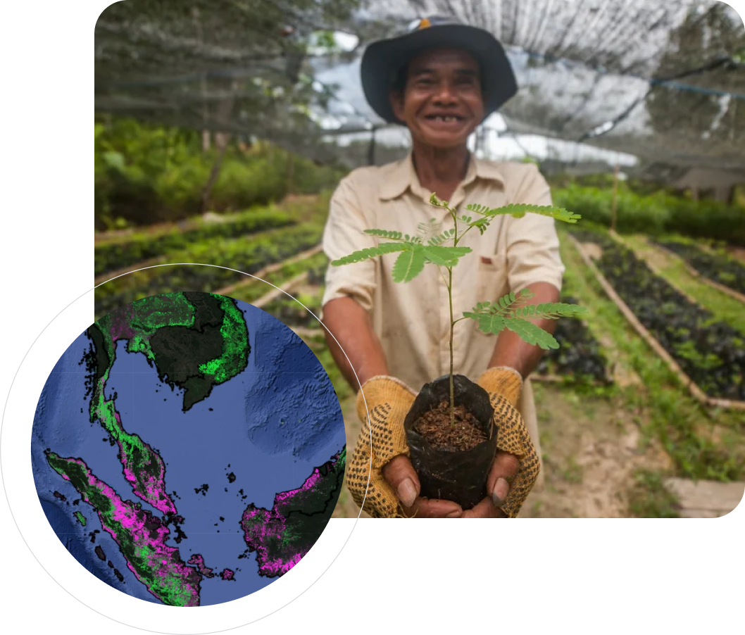 A smiling farmer holds out a tree sapling with a circular map overlay in the foreground.