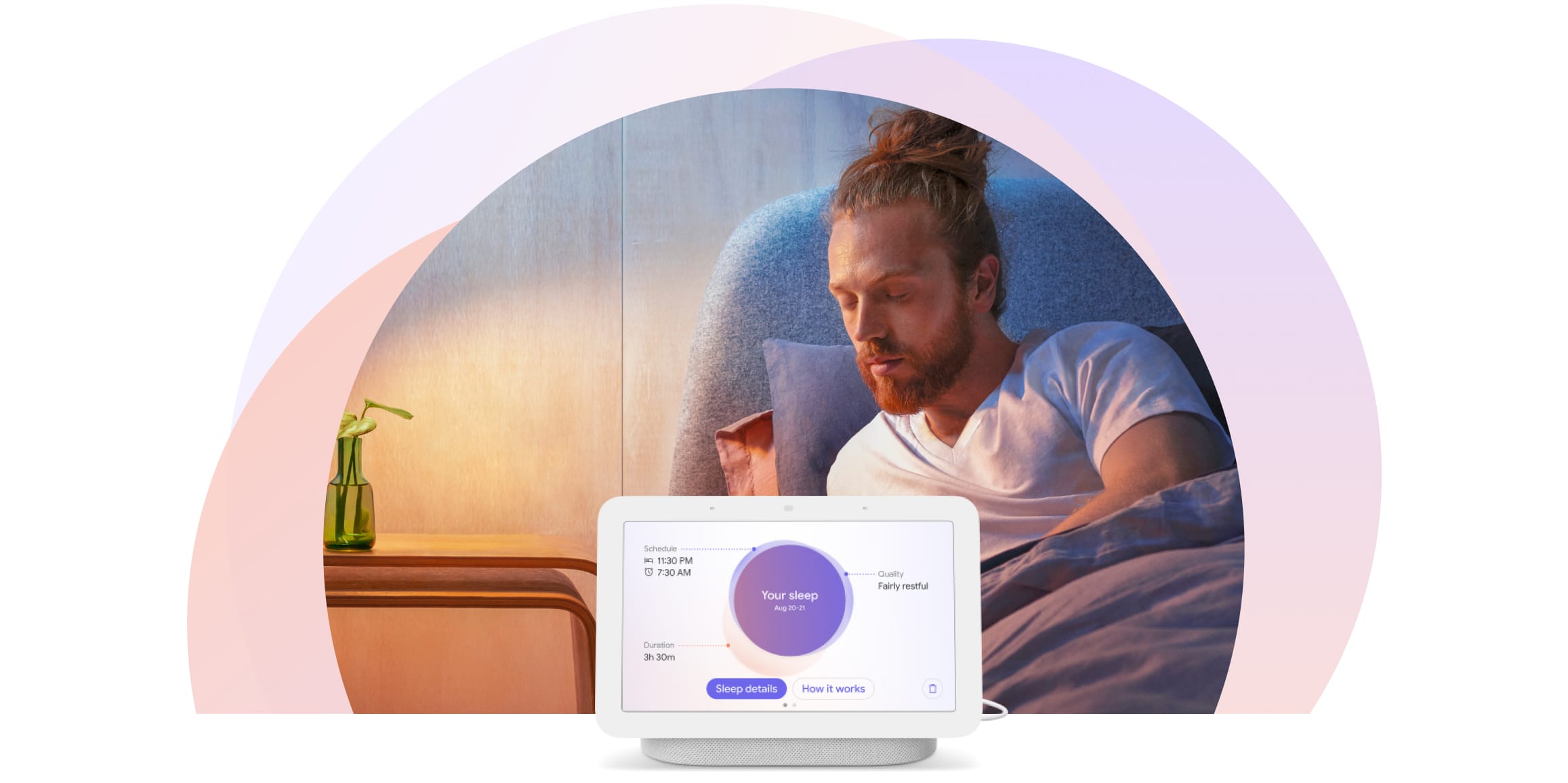 The man is sitting upright in bed and is turning toward his Nest Hub display at his bedside. It shows personalized insights about his sleep.