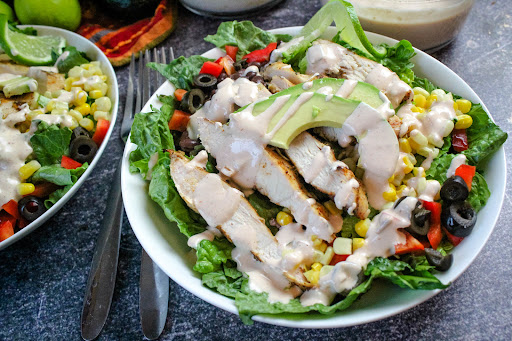 Dressing drizzled over the Southwest Grilled Chicken Salad.