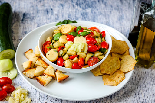 Chopped Caprese Salad with crackers and toasted bread.
